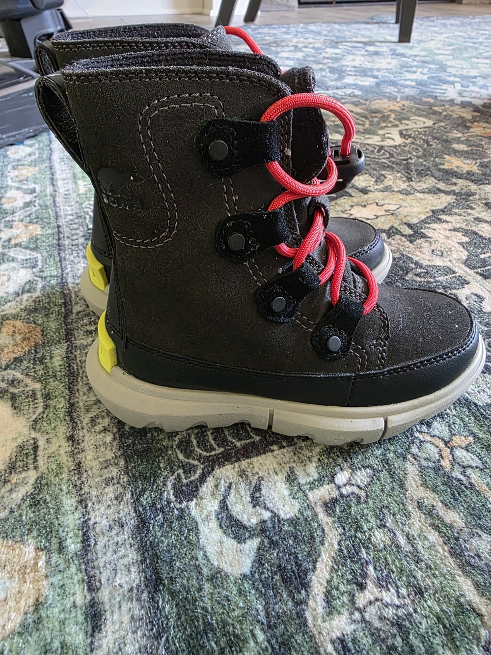 Sorel Kids Black Boots with Red Laces and Yellow Heel Accent